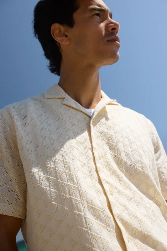 Mens Blend Aulia Short Sleeved Shirt Bleached Sands Smart Shirt by Blend. Colour: Salute Material: 100% Cotton Man wearing a light-colored textured shirt against a clear blue sky