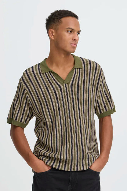 Blend Carly Polo Knit Top Winter Moss mens Smart Stylish Top from Blend. Colour: Winter Moss Material: 100% Cotton Man wearing a patterned shirt with green collar and trim on a white background