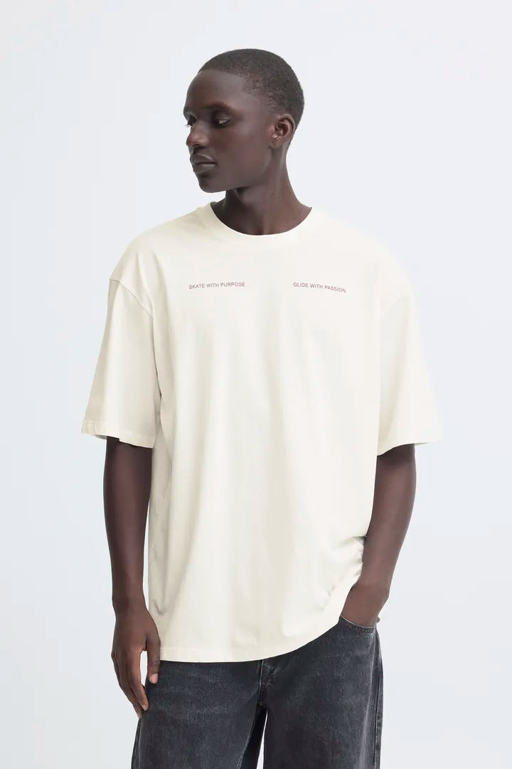 Blend Keaton Backprint T-shirt Snow White men's Casual T-shirt by Blend. Colour: Snow White Material: 100% Cotton Person wearing a beige t-shirt with text on a white background