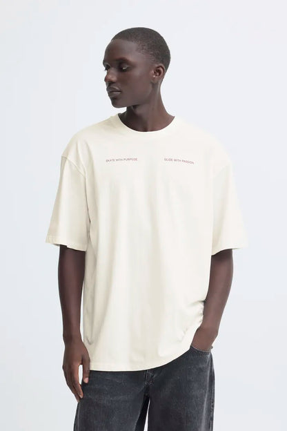 Blend Keaton Backprint T-shirt Snow White men's Casual T-shirt by Blend. Colour: Snow White Material: 100% Cotton Person wearing a beige t-shirt with text on a white background