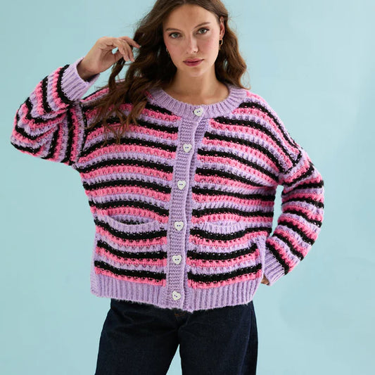Cara & The Sky Bernice Stripe Cross Stitch Cardigan Lilac Womens Cardigan oversized Woman wearing a striped crochet cardigan against a light blue background