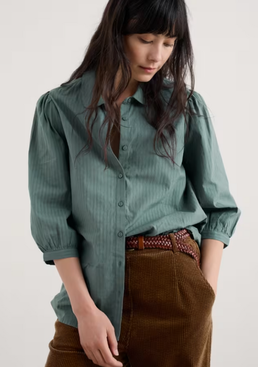 Seasalt Hope Cottage Organic Cotton Check Blouse Cliff Womens Shirt Seasalt Clothing  Woman wearing a green shirt and brown pants against a plain background