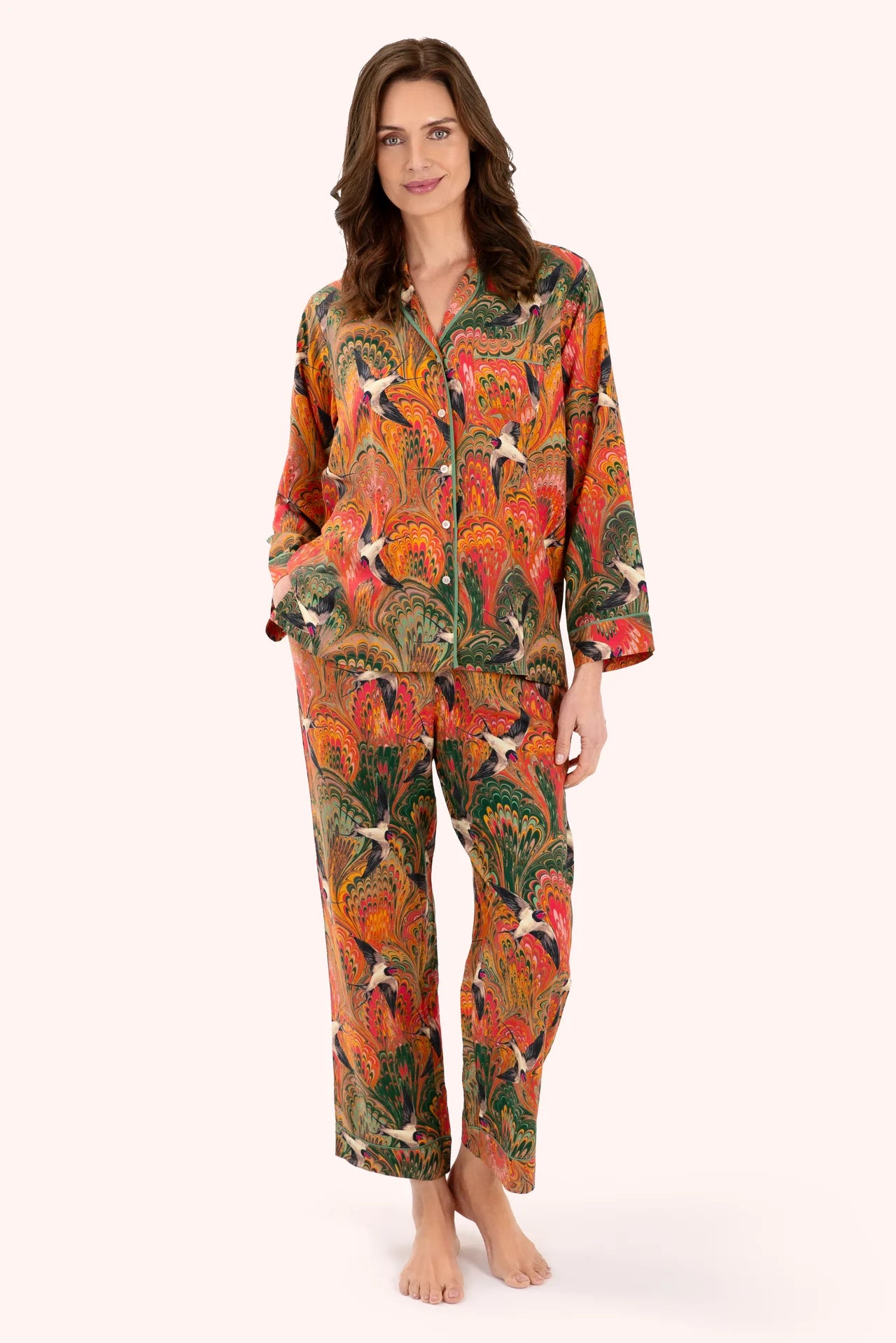 Powder Supersoft Marbled Swallows Pyjamas Womens Pyjamas Powder Accessories Powder Clothing Woman wearing a colorful pajama set with a pattern on a white background