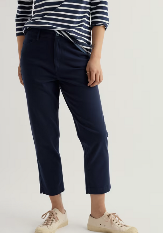 Seasalt Albert Quay Crops Maritime womens summer trousers Slim leg fit with Zip and button fastening and Front and back pockets Colour: Maritime Material: 98% Organic Cotton & 2% Elastane Person wearing navy pants and a striped shirt on a plain background
