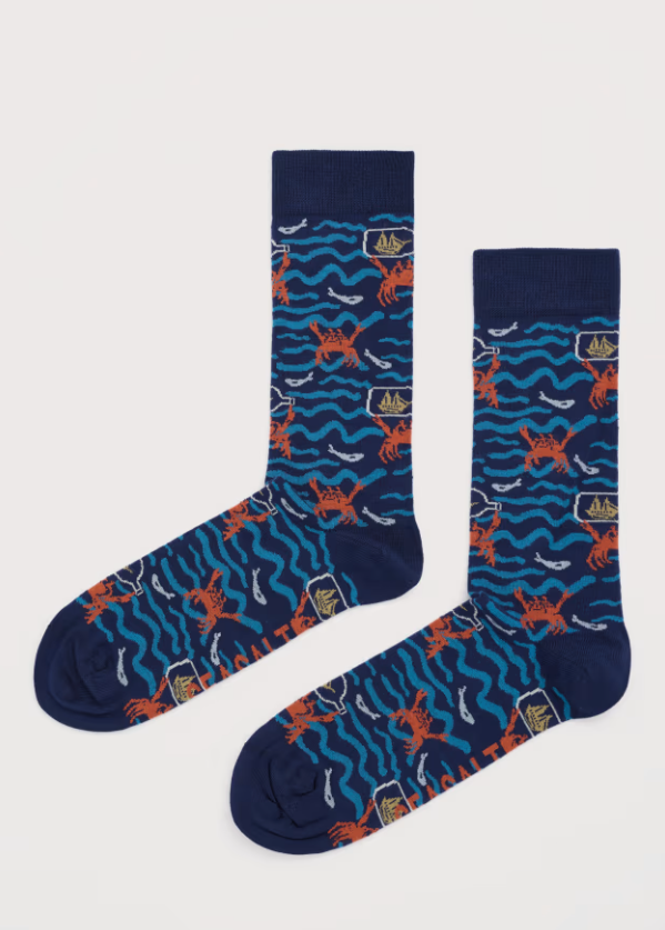 Seasalt Men's Arty Socks Summer Nautical Squall Material: 71% Bamboo (Derived Viscose), 28% Recycled Polyamide & 1% Elastane Pair of blue socks with orange crab pattern on a white background