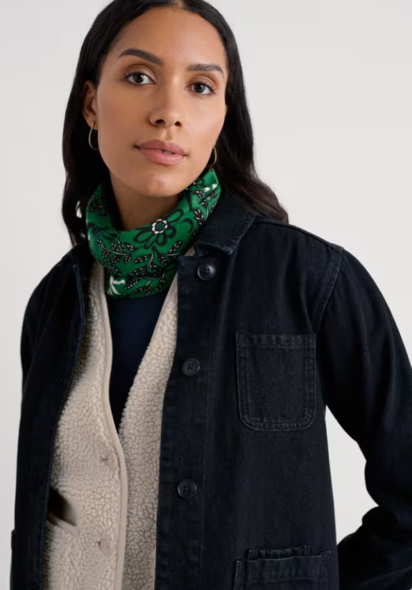 Seasalt Organic Cotton Handyband Evening Woodland Fern Woman wearing a green patterned scarf with a plain background