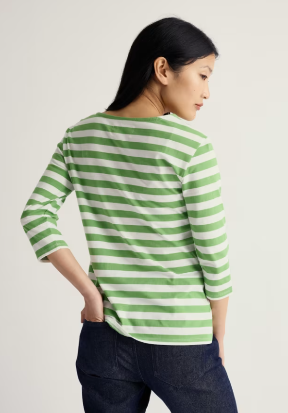 Seasalt Sailor 3/4 Sleeve Top Jersey Scallion Clover Leaf womens Relaxed fit with Yarn-dyed stripes and a Boat neck that's Machine Wash 30C Colour: Scallion Clover Leaf Material: 100% Organic Cotton Woman wearing a green and white striped shirt against a plain background