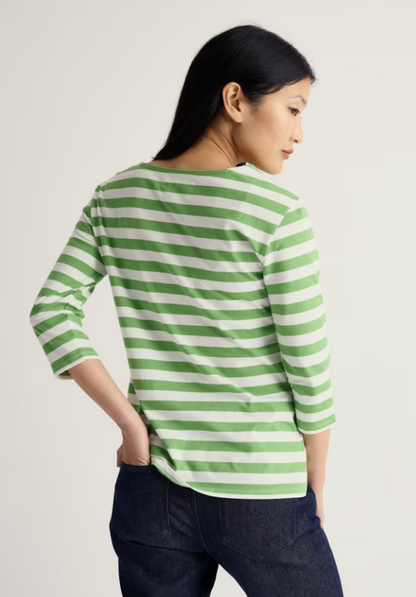 Seasalt Sailor 3/4 Sleeve Top Jersey Scallion Clover Leaf womens Relaxed fit with Yarn-dyed stripes and a Boat neck that's Machine Wash 30C Colour: Scallion Clover Leaf Material: 100% Organic Cotton Woman wearing a green and white striped shirt against a plain background