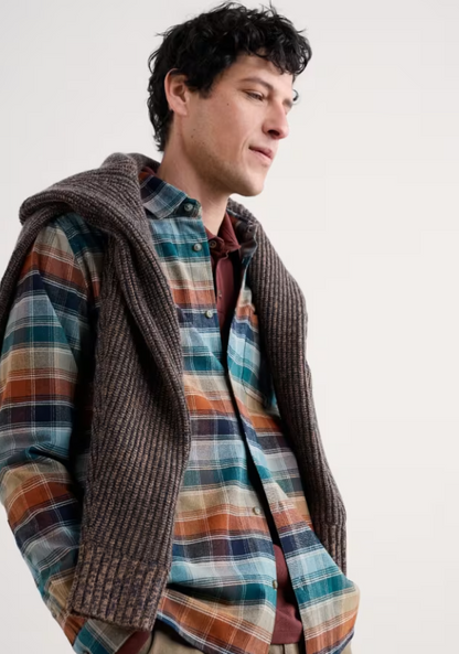 Seasalt Men's Fathomer Checked Shirt Root Cellar Light Wade Seasalt Mens Seasalt shirt Checked shirt Man wearing a plaid shirt and knitted cardigan against a plain background