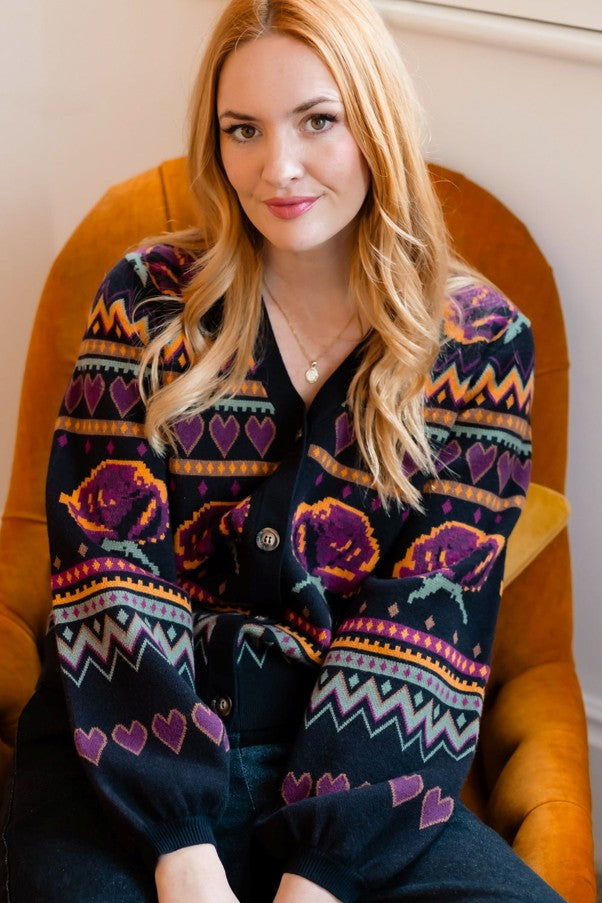 Sugarhill Brighton Adrian Cardigan Black Wild Roses. Womens Buttoned front cardigan with V-neck and Blouson sleeve that's Machine washable (delicate). Material: 51% Viscose, 30% Polyester & 19% Nylon
