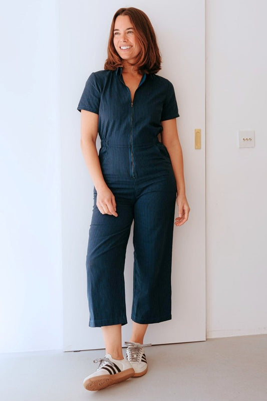Sugarhill Brighton Cora Cropped Jumpsuit Black/Teal Thin Stripe women's Elasticated waistband that had a Zip front and Wide flared leg with a Rear patch pockets and side pockets and is Machine washable (delicate) Colour: Black/Teal Thin Stripe Material: 100% Organic Cotton