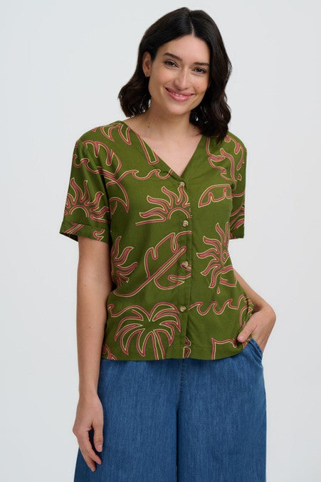 Sugarhill Clothing Brighton Hatty V-Neck Shirt Khaki Tropical Line Drawing. Womens V neck shirt, Short turned up sleeves, Functional front buttons, Revere shirt collar and is Machine washable (Delicate) Material: 100% Lenzing Ecovero Viscose Description: The Sugarhill Brighton Hatty V-Neck Shirt brings effortless style with its striking tropical plant design in green and pink. Crafted from luxuriously soft Lenzing viscose