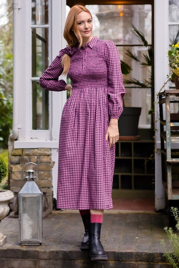 Sugarhill Diana Shirred Midi Dress Rose Gingham. Womens Lightweight woven fabric with Collared neckline with half-button placket and Smocked, fitted bodice that's Long sleeves with elasticated cuffs and Full, gathered midi skirt that's Machine Washable (Delicate) Colour: Rose Gingham Material: 100% LENZING™ ECOVERO™ Viscose