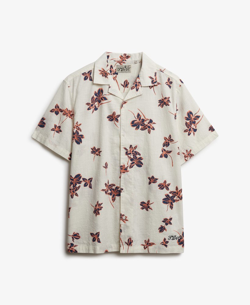 Superdry Cabana Poolside Short Sleeve Shirt Lotus Flower Off White mens Relaxed fit – the classic Superdry fit with Single collar with button fastening and Embroidered text on the hemline Colour: Lotus Flower Off White Material: 100% Organic Cotton Floral patterned shirt on a white background