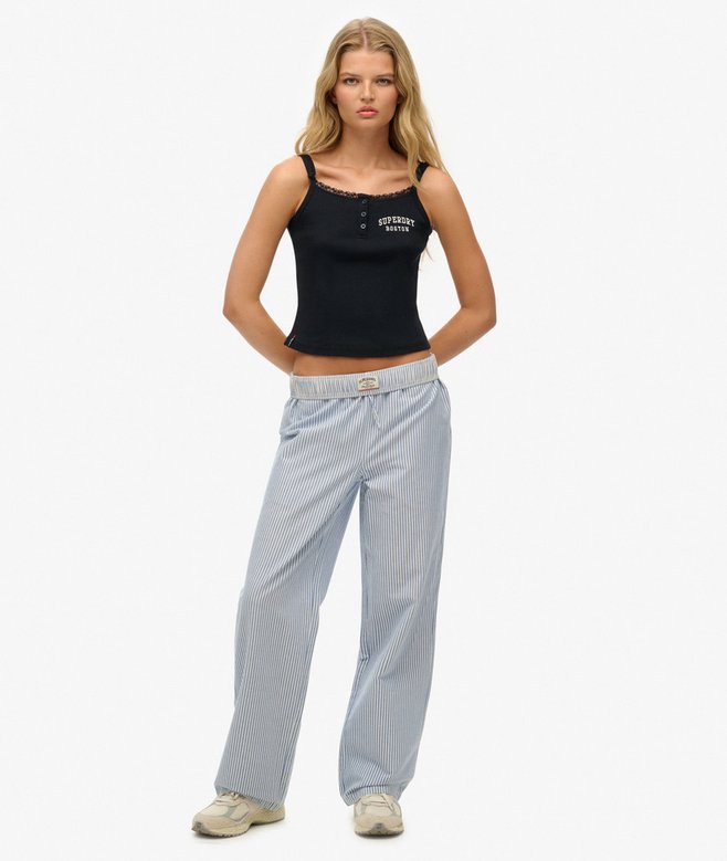 Superdry Organic Cotton Stripe Elasticated Trousers Azure Blue Stripe Oxford womens Straight Fit Classic for a reason the original fit that gives you extra room throughout without being baggy or too loose fitting. About as authentic as you get Size up to get that on-trend looser fit Elasticated waistband with an adjustable drawstring and three pockets Embroidered logo on the back pocket Colour: Azure Blue Stripe Oxford Material: 100% Organic Cotton