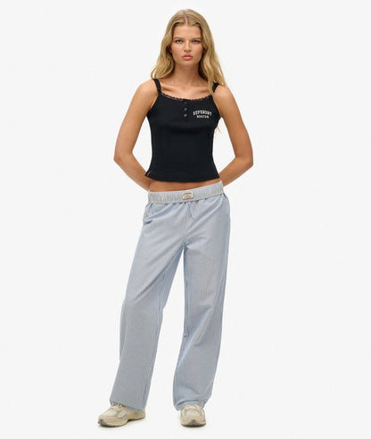 Superdry Organic Cotton Stripe Elasticated Trousers Azure Blue Stripe Oxford womens Straight Fit Classic for a reason the original fit that gives you extra room throughout without being baggy or too loose fitting. About as authentic as you get Size up to get that on-trend looser fit Elasticated waistband with an adjustable drawstring and three pockets Embroidered logo on the back pocket Colour: Azure Blue Stripe Oxford Material: 100% Organic Cotton