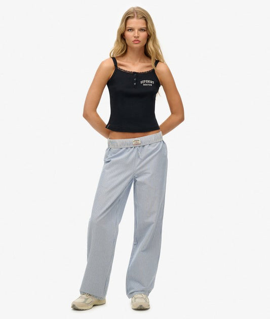 Superdry Organic Cotton Stripe Elasticated Trousers Azure Blue Stripe Oxford womens Straight Fit Classic for a reason the original fit that gives you extra room throughout without being baggy or too loose fitting. About as authentic as you get Size up to get that on-trend looser fit Elasticated waistband with an adjustable drawstring and three pockets Embroidered logo on the back pocket Colour: Azure Blue Stripe Oxford Material: 100% Organic Cotton