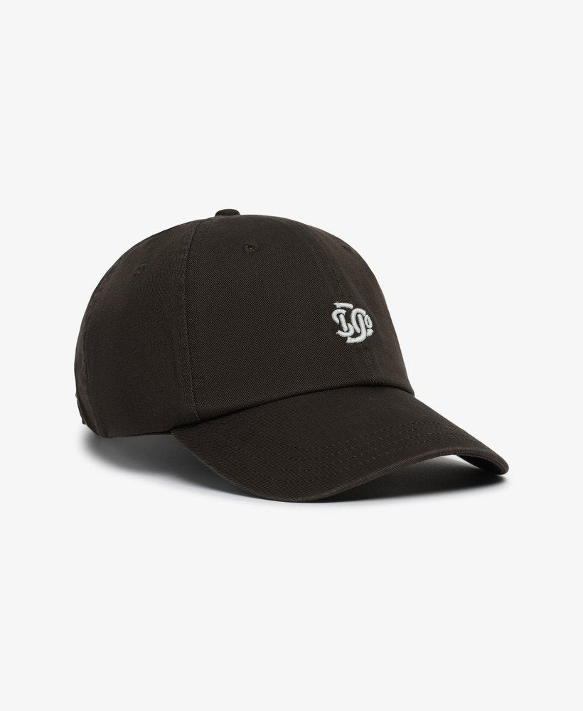 Superdry SD Embroidered Baseball Cap Vintage Black Classic baseball style hat with Six-panel design and a Curved peak with Strap back adjuster and Embroidered Superdry branding Colour: Vintage Black Material: 100% Cotton
