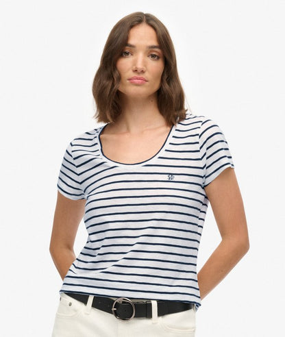 Superdry Studios Scoop Neck T-Shirt Optic/Navy Stripe womens Buy 3 Studio or Slub T-Shirts For £50 Material: 60% Cotton & 40% Lyocell Relaxed fit – the classic Superdry fit. Not too slim, not too loose, just right. Go for your normal size with a Scoop neck and Short sleeves that's Embroidered Superdry logo Woman wearing a white and blue striped t-shirt on a plain background