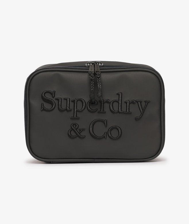 Superdry Travel Wash Bag Black. Wash bag with Top handle and Zip sealed plastic compartment with Internal zip pocket and Mesh fabric laid on pockets Material: 100% Polyester