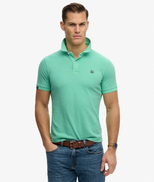 Superdry Vintage Destroy Polo Shirt Spring Bud Green mens Relaxed fit the classic Superdry fit. Not too slim not too loose just right. Go for your normal size with a Single collar with button fastening and Signature badge on the chest Colour: Spring Bud Green Material: 100% Organic Cotton Style Code: M1110451A