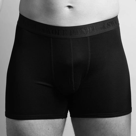 Swole Panda Bamboo Boxers Black/Black Mens Underwear Fitted bamboo boxers combine comfort and style. Material: 95% Moso Bamboo & 5% Elastane Knitted Black boxer briefs worn by a person on a plain background