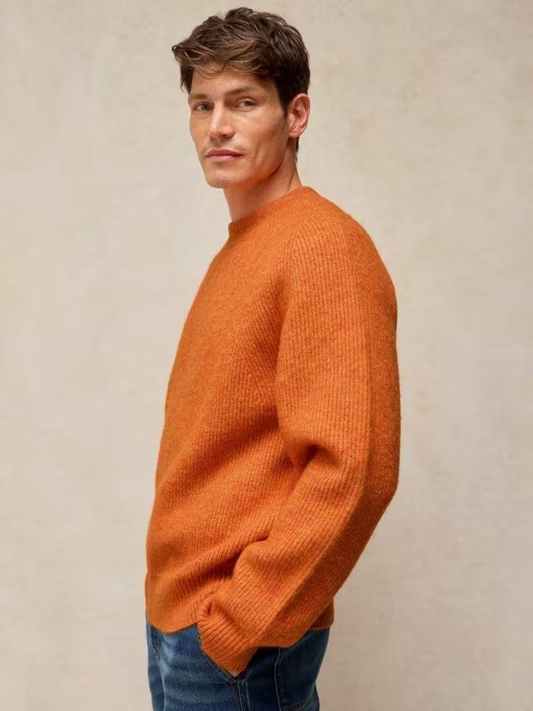 White Stuff Flint Fisherman Jumper Bright Orange. Men's Crew Neck with Long Sleeve and a Classic Fit that's Machine Washable. Material: 54% Recycled Polyester, 38% Acrylic, 5% Wool & 3% Elastane