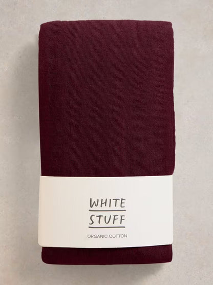 Purple tight on white background. Comfortable and versatile White Stuff Patty cotton tights in Dark Plum. Made with 77% organic cotton for all-day comfort. Ideal for the British weather. 