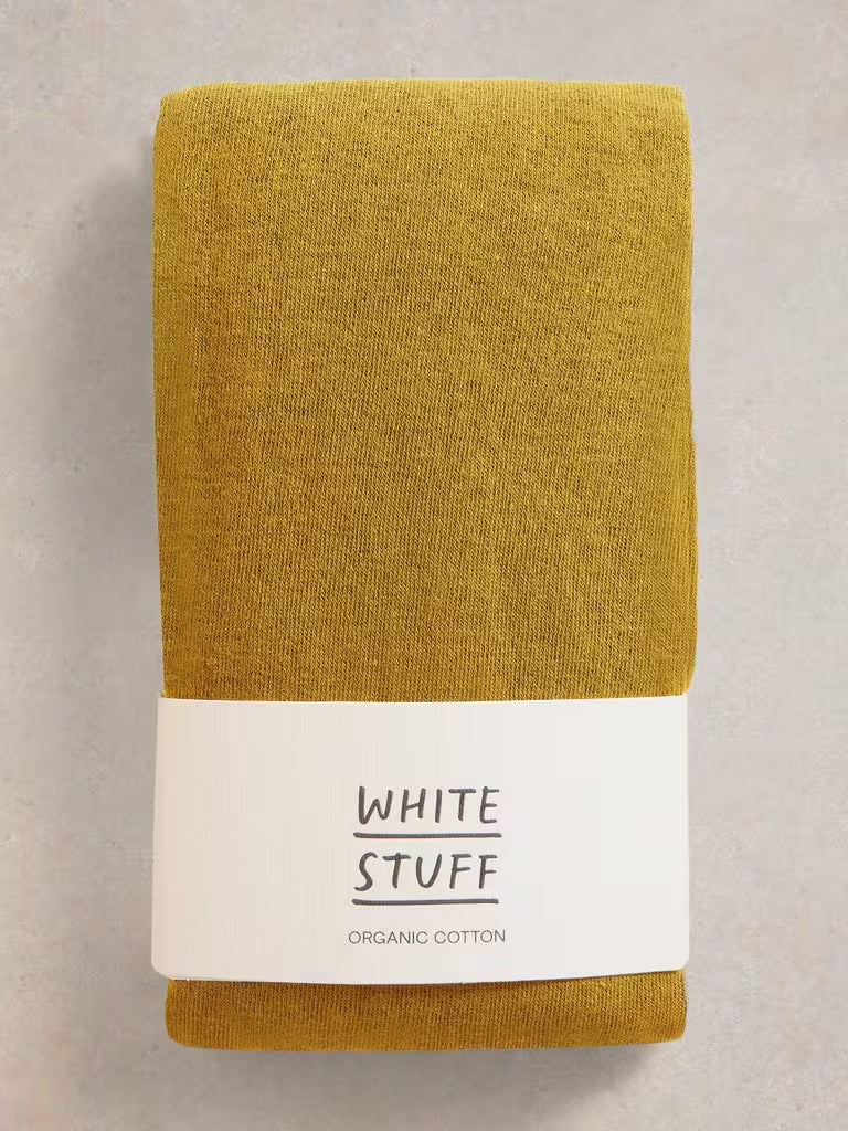 Yellow tight on white backgroud Comfortable and versatile White Stuff Patty cotton tights in Mid Chartreuse. Made with 77% organic cotton for all-day comfort. Ideal for the British weather.