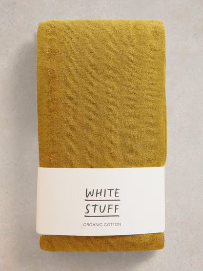 Yellow tight on white backgroud Comfortable and versatile White Stuff Patty cotton tights in Mid Chartreuse. Made with 77% organic cotton for all-day comfort. Ideal for the British weather.