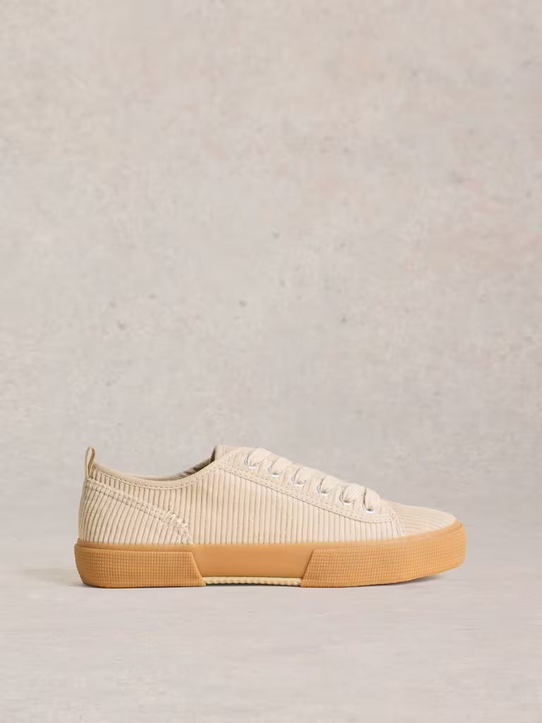 White Stuff Pippa Cord Lace Up Trainer Light Natural womens Pippa trainers have had a revamp. In a textured cord material and lace up style. (Now that's fancy footwork.) Colour: Light Natural Material: Upper: Recycled Cotton, Lining: Cotton, Sole: Rubber Beige sneaker with a brown sole on a light gray background