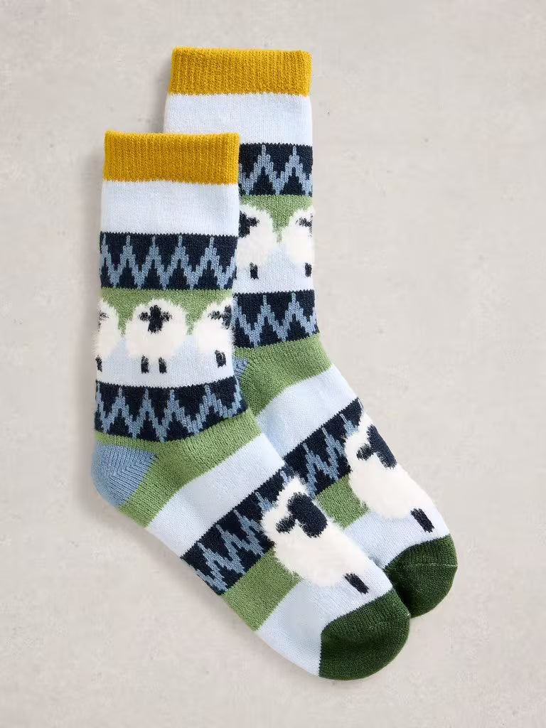 White Stuff Fluffy Sheep Cabin Socks Blue Blue mens Socks White Stuff clothing Fluffy sock Pair of socks with sheep pattern on a beige background